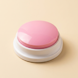 WordyPaws talking button in Macaron Pink on a cream studio background